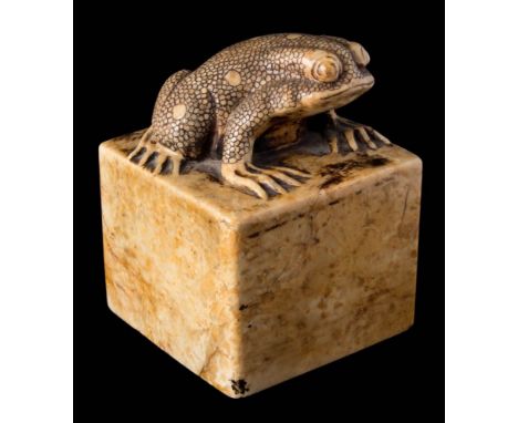 A Chinese carved soapstone seal: of sandy brown colour and square form topped with a toad, six character zhuanshu seal mark t