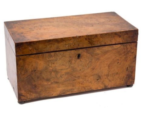 A 19th century burr walnut tea caddy: of rectangular outline, the hinged lid enclosing a central well with two lidded compart
