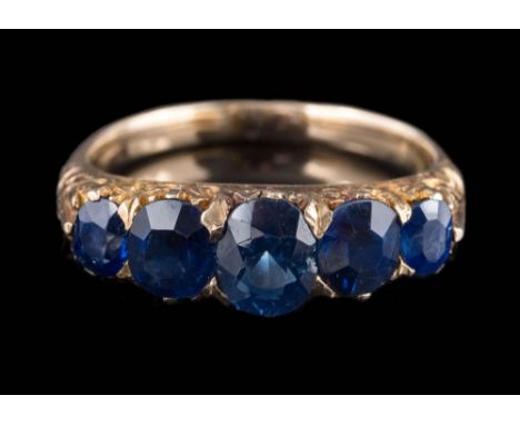 A late 19th century gold and  sapphire five-stone half-hoop ring: the cushion-shaped sapphires graduated from 6.2mm long x 5.