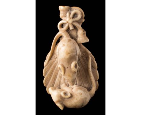 A Japanese carved ivory netsuke:  of two rats standing on the back of a mirror, unsigned, 7cm. long.