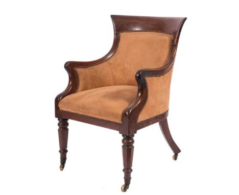 An early Victorian mahogany bergere armchair:, with curved bar top rail, upholstered panel back, arm supports and seat in lig