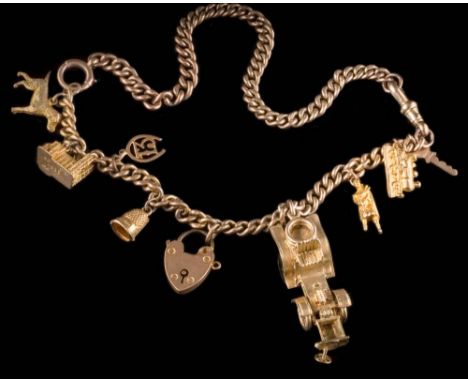 A 9ct gold curb-link watch chain converted to be worn as a two-strand bracelet: with nine attached various charms including a