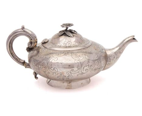 A Victorian silver teapot , maker Charles Lias, London, 1847: of squat circular form, with engraved foliate and scroll decora