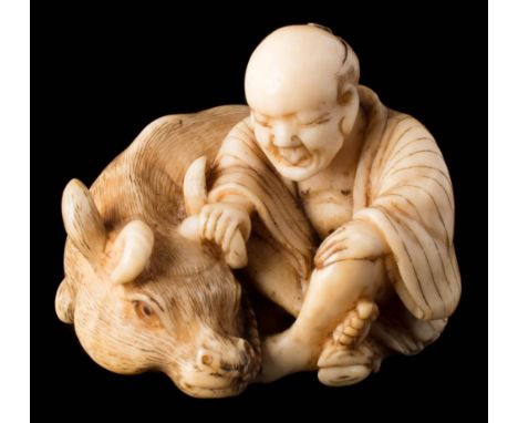 A Japanese carved ivory  netsuke: of a farmer seated with his oxen, signed Masayoshi, 3.5cm. wide.