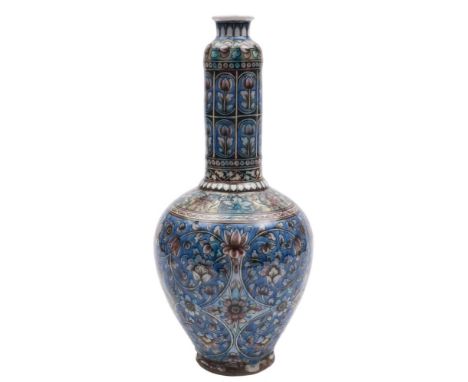 A group of four pieces of Turkish Kutahya pottery: including two long-necked jars, a globular vase and a ewer, all decorated 
