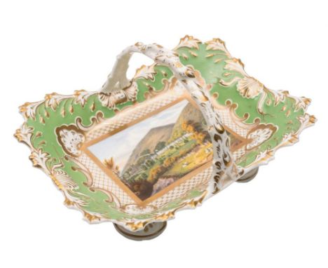 A Chamberlains Worcester 'Malvern' topographical porcelain basket: with rustic branch handle and anthemion bracket feet, pain