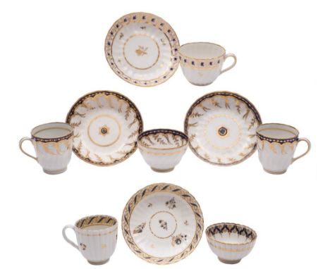 A group of New Hall hardpaste spiral fluted and reeded tea and coffee wares: painted and gilded with foliate borders and spri