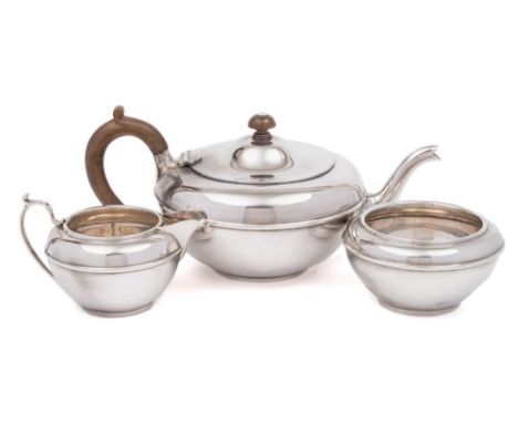 A George V silver three piece tea service, maker Charles &amp; Richard Comyns, London, 1921: of plain circular form with ribb