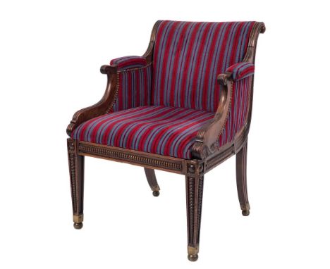 A Regency carved beech and simulated rosewood armchair:, with upholstered curved back, padded arm supports with reeded termin