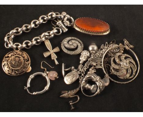 A quantity of silver and white metal jewellery including charm bracelet, abstract marcasite set ring, stone set pendant etc