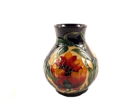 A boxed Moorcroft Fire Flower pattern vase, circa 2005, designed by Rachel Bishop, base with all relevant marks, height 6"