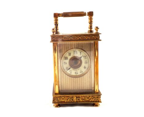 A brass carriage clock with escapement movement, enamel dia marked Payne & Co Tunbridge Wells, with key (movement as found)