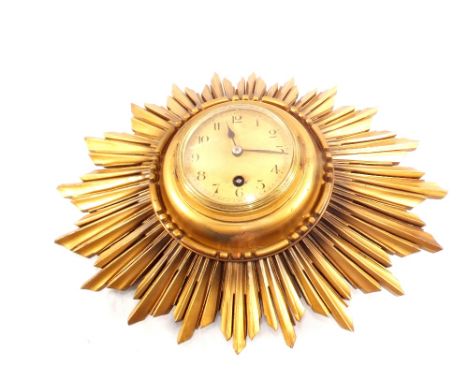 A giltwood sunburst wall clock