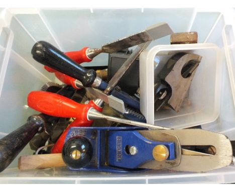 A box of various woodworking tools