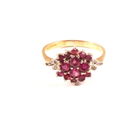 A 9ct gold ruby and diamond cluster ring, size P