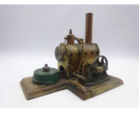 Early 20th century brass stationary steam plant, the horizontal boiler with five-light spirit burner powering a fly wheel mou