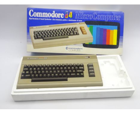 Commodore 64 Micro Computer games console in original box with games and accessories including C2N cassette unit and boxed jo