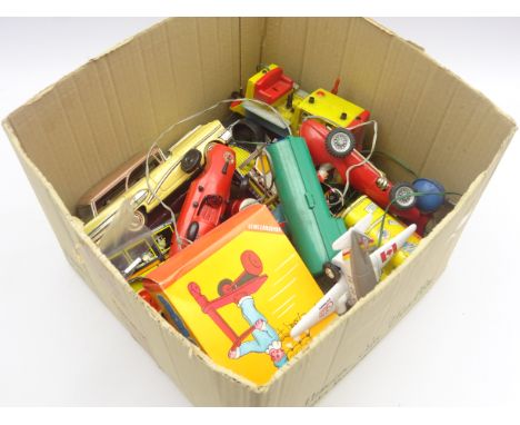 Mechanical toys: sixteen tin-plate and plastic, clockwork and battery operated toys including railway porter on trolley, cars