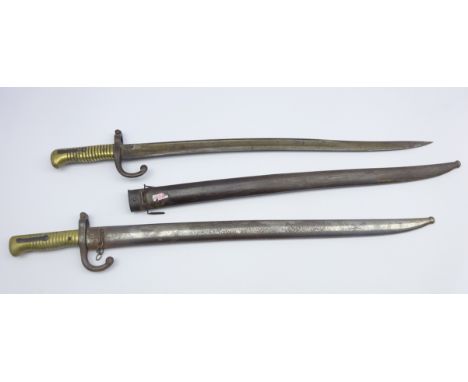 Two French Model 1866 Sabre bayonets, each with curving fullered steel blade, brass grip and steel scabbard L72cm overall Con