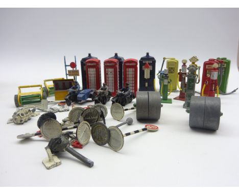 Dinky - quantity of unboxed accessories including three Police boxes, three telephone boxes, nine petrol pumps, oil dispenser