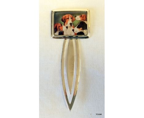 A silver and enamel large book mark depicting dogs