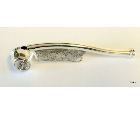 A silver stamped 925 bosons whistle