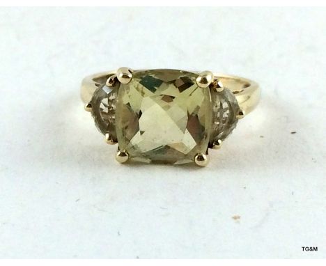 A 9ct gold Peridot and aquamarine ladies ring size P/Q