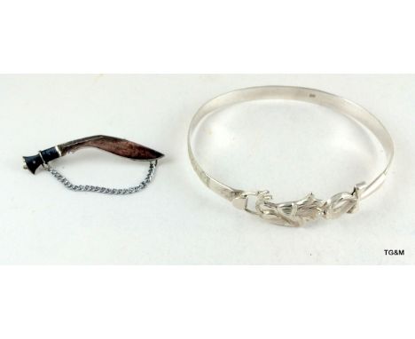 A Silver Bangle and Silver Kukri 