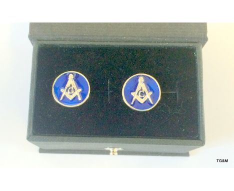 A pair of silver and enamel set Masonic cufflinks