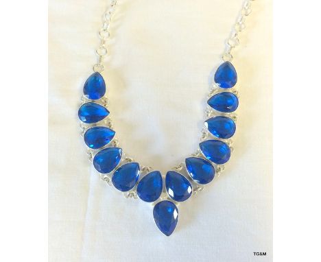 A large silver and blue semi precious stone necklace