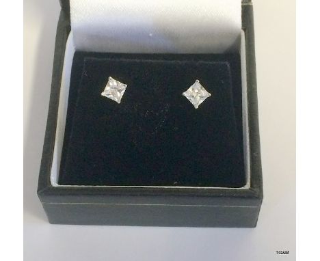 A pair of silver and Cz stud earrings