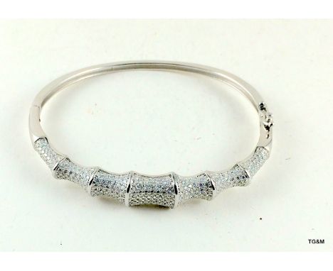 A silver and Cz bamboo style bangle