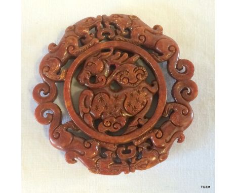 A round carved jade bi