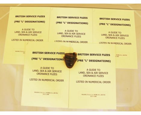 A British army shell Fuze marked with the War Department arrow and 5 privately produced copies of a Guide to British Service 