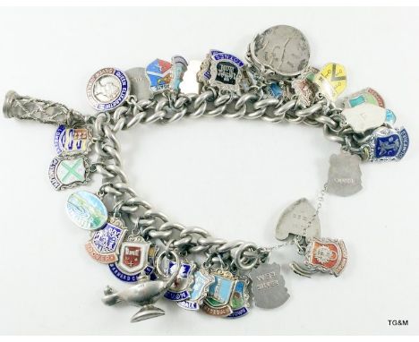 Silver charm bracelet and 24 charms