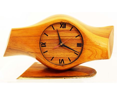 An impressive WW1 trench art mantle clock made from a wooden propeller boss and standing on a section of propeller blade with