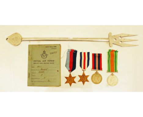 A WW2 medal group of four including the France & Germany Star with his Service & Release Book and an aluminium toasting fork 