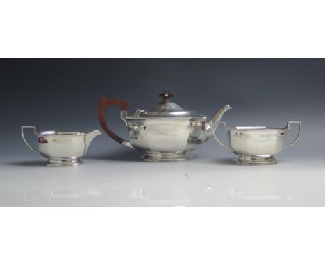 A George VI silver three-piece tea service, maker Adie Brothers Ltd, Chester 1938, of lozenge-shaped design, with gadrooned r