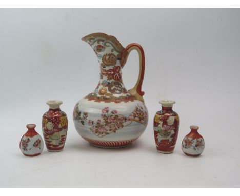 A Kutani porcelain pitcher of squat globular form, the neck decorated with flowerheads, the body with prunus and floral decor