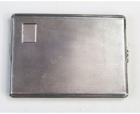 A George VI silver cigarette case, maker Padgett &amp; Braham Ltd, London, 1941, with engine turned decoration, 12cm wide. 15