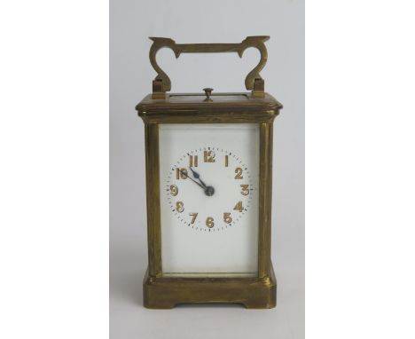 A French Brass Repeating Carriage Clock, 15cm high. Winds, balance turning and repeat button working, needs attention 