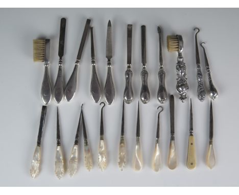 A collection of silver handled and mother-of-pearl handled manicure items, nail files, button hooks, toothbrushes etc, variou