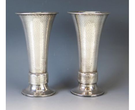 A pair of George V hammered silver vases, maker A. E. Jones, Birmingham, 1924, in the Arts &amp; Craft style, of tapering cyl