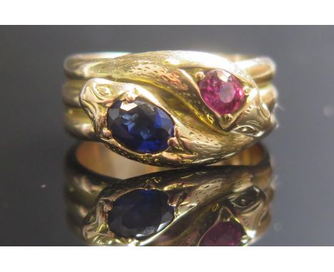 A Gent's Ruby and Sapphire Double Snake's Head Ring in a precious yellow metal setting, c.6.7x5.2mm sapphire and 5.1x4.8mm ru