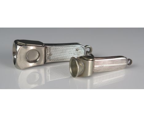 An Elizabeth II silver framed cigar cutter, maker W M Ltd, Birmingham, 1971, with engine turned decoration, 6cm long, togethe