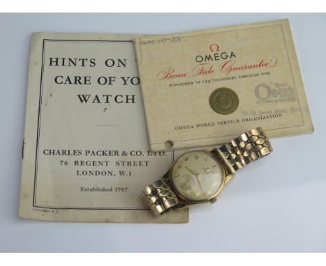 An OMEGA Gent's 9ct Gold Cased Manual Wind Wristwatch, 33.7mm case, sold with booklets Winds &amp; runs 