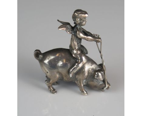 A continental silver model of a cherub riding on the back of a pig, unmarked, 4cm long, 21gms, 0.70ozs 