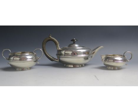 An Edward VII silver three-piece tea service, maker W.N possibly William Norton, Chester, 1905, of squat circular form, with 