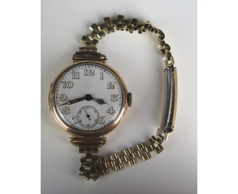A LONGINES 9ct Gold Wristwatch, the 31mm case with enamel dial and subsidiary seconds dial, 16 jewel manual wind movement, 30