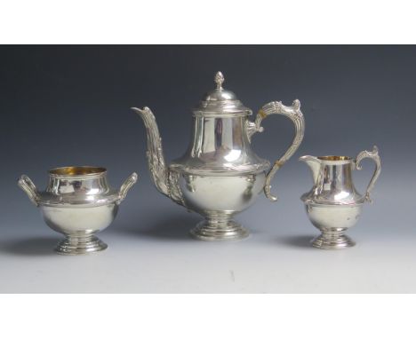 An Edward VII silver three-piece tea service, maker Walker &amp; Hall, Chester, 1906, of baluster form with reeded girdle, th